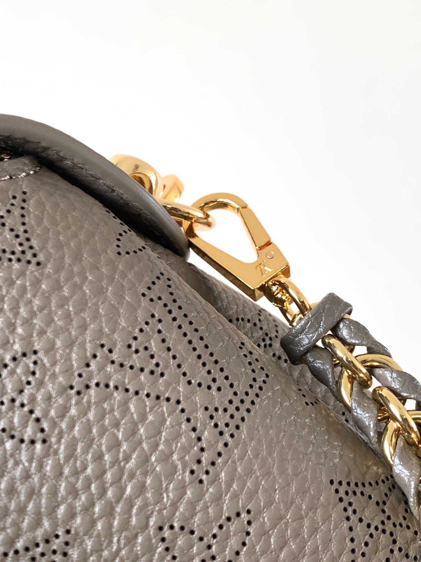 LV M25904 Hand It All PM Taupe Perforated Mahina Calfskin