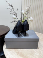 CURVED HEEL DEEP MOUTH PUMPS IN BLACK CALFSKIN