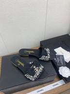 BOW SLIPPERS IN BLACK LAMBSKIN WITH RHINESTONES