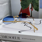 FIRST CRYSTAL RIMLESS OVAL FRAME SUNGLASSES 557152 IN METAL