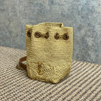 DRAWSTRING BUCKET BAG 19 IN BEIGE WOVEN RAFFIA AND CALFSKIN