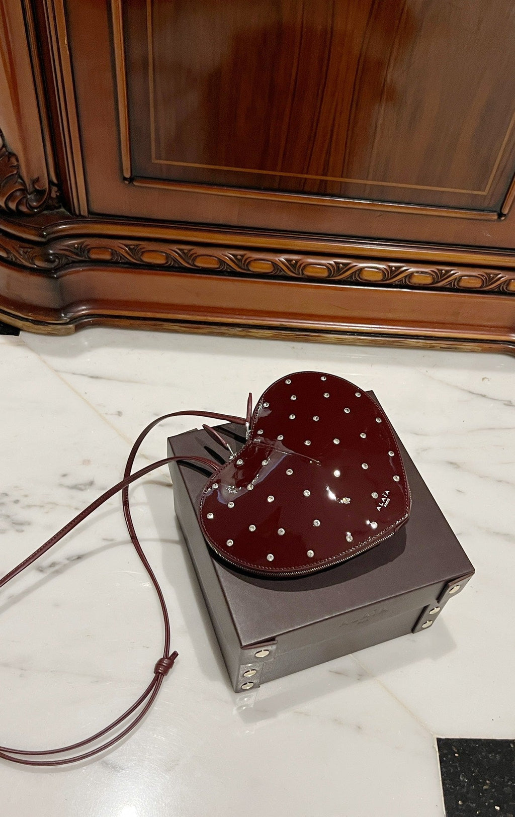 LE COEUR BAG 21 IN BURGUNDY RED PATENT CALFSKIN ATTACHED STRASS