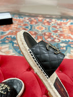 FLAT SLIPPERS IN BLACK LAMBSKIN AND WOVEN WITH LOGO