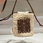 LOE ANAGRAM MINI 18 BUCKET BAG IN NATURAL RAFFIA
