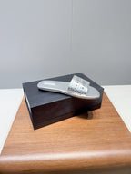 ALAIA FLAT SANDALS WITH PERFORATED STRAPS 25S IN SILVER LAMBSKIN
