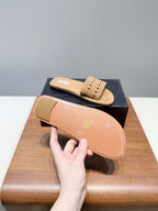 ALAIA FLAT SANDALS WITH PERFORATED STRAPS 25S IN BEIGE SUEDE