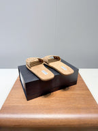 ALAIA FLAT SANDALS WITH PERFORATED STRAPS 25S IN BEIGE SUEDE