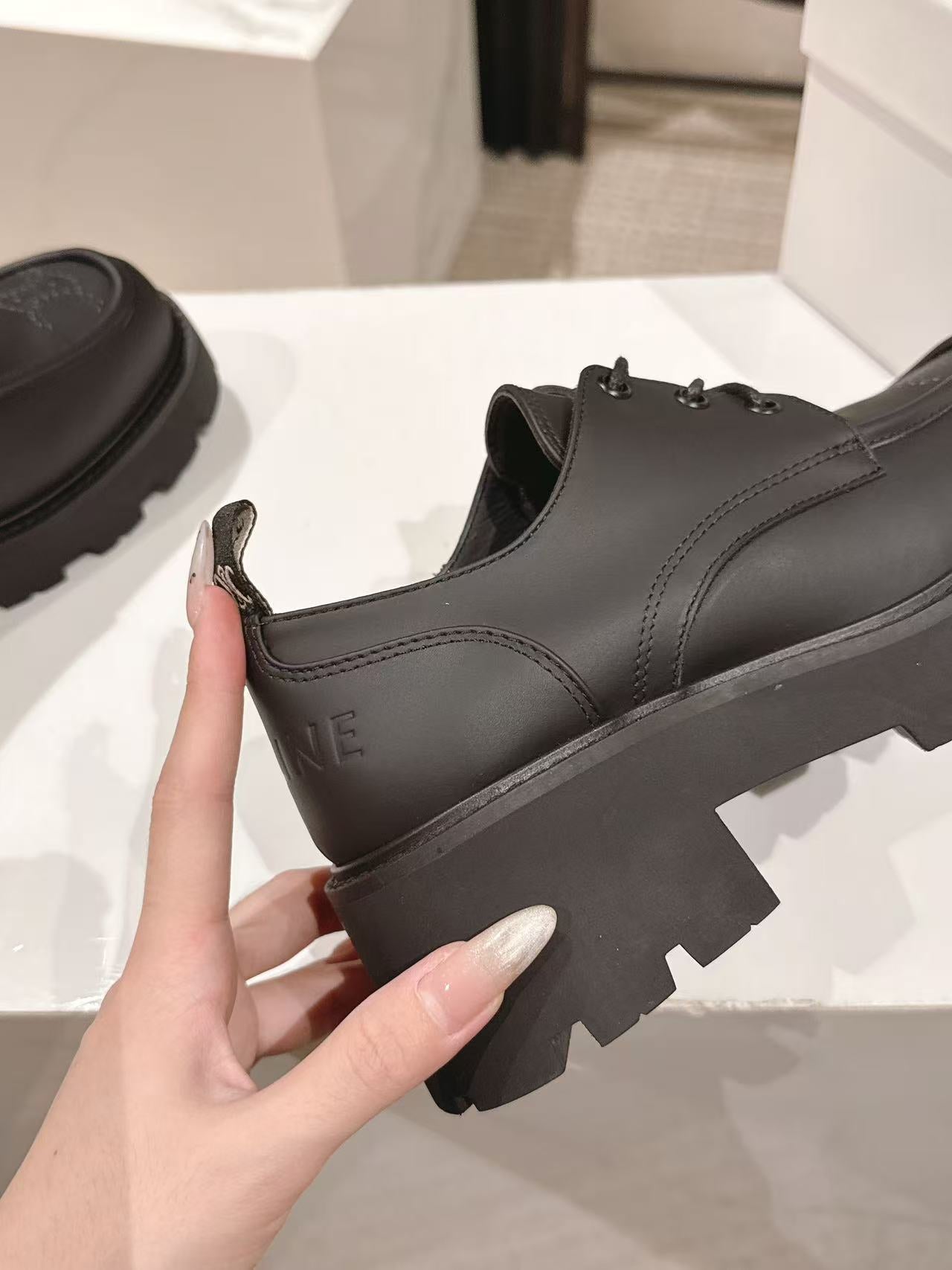 CELINE 25S THICK SOLED LOAFERS 50MM IN BLACK CALFSKIN