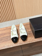 CHANEL 25S BALLET MARY JANES BLACK AND IVORY IN CALFSKIN