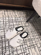 FLAT MULES IN WHITE CALFSKIN