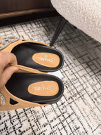 FLAT MULE IN SEPIA BEIGE CALFSKIN