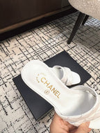 MID HEEL MULES IN WHITE SHEEPSKIN