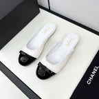 BOW MULE IN WHITE FUR AND BLACK CALFSKIN