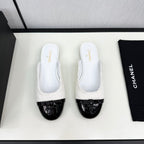BOW MULE IN WHITE FUR AND BLACK CALFSKIN