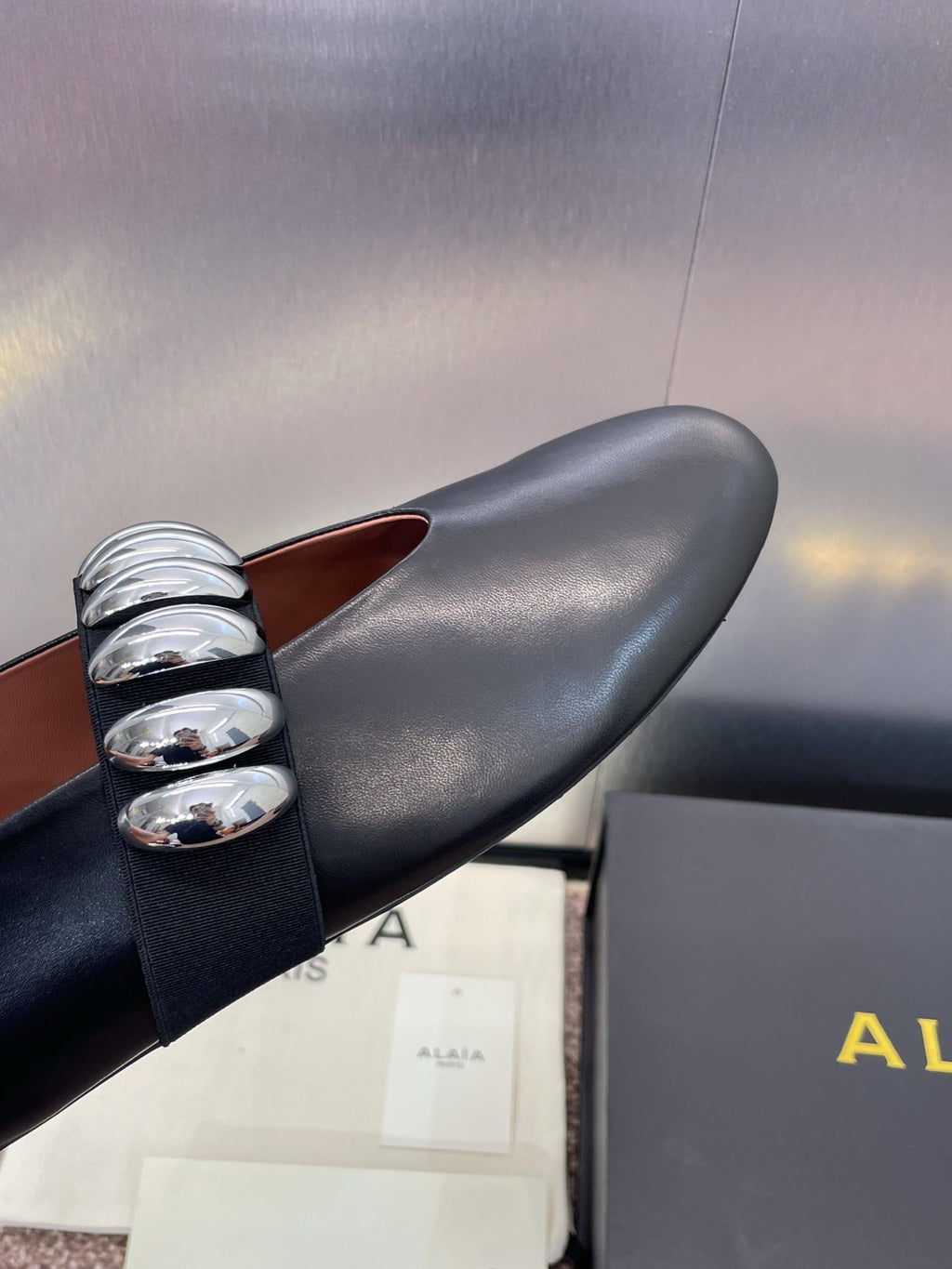 ALAIA MARY JANE FLATS 25S IN BLACK CALFSKIN WITH SILVER HARDWARE