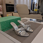 BOW-EMBELLISHED HIGH MULES IN SILVER METALLIC SHEEPSKIN