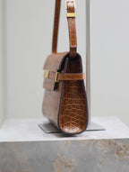MANHATTAN SMALL 24 IN BROWN CROCODILE PATTERN CALFSKIN GOLD BUCKLE