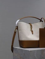 YSL 25S LE 5 À 7 BUCKET 26 IN CREAM BROWN CALFSKIN AND CANVAS GOLD HARDWARE