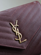 CASSANDRE CLUTCH 21 IN BORDEAUX RED LAMBSKIN GOLD HARDWARE