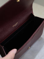 CASSANDRE CLUTCH 21 IN BORDEAUX RED LAMBSKIN GOLD HARDWARE