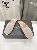 ALAIA FLAT MULES IN WHITE MESH FISHNET