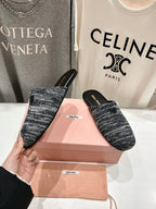 KNITTED MULES IN BLACK MIX WHITE WOOL