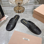 MULES SLIPPERS BLACK COWHIDE
