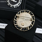 25P BROOCH IN BLUE DENIM BLACK LEATHER-THREADED OVAL