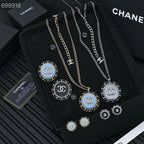 CC 25P STUD EARRINGS IN BLUE DENIM BLACK CALFSKIN-THREADED BUTTON