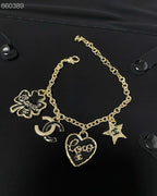 CC BRACELET IN GOLD PLATING CHAIN WITH MULTI CHARM