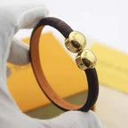 LV LEATHER ROPE 2 MOTIFS GOLD BRACELET